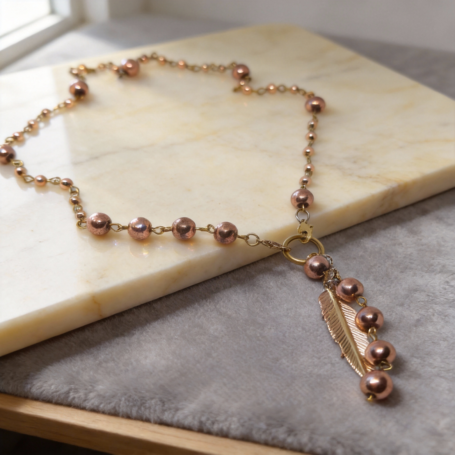 Handcrafted delicate necklaces with fine beads, gold-plated accents and a round pendant by Gem N Glow by Natali