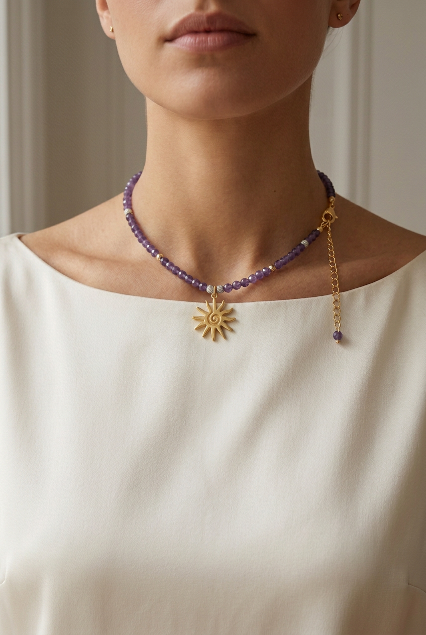 Woman wearing a natural amethyst necklace with gold sun pendant