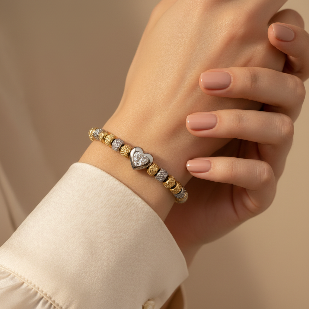 Woman wearing a stainless steel and gold-plated zircon heart bracelet