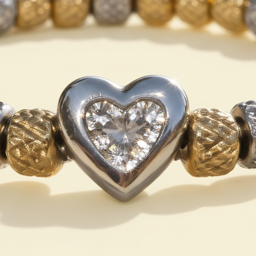 Close-up of the sparkling zircon heart and textured metal bracelet elements