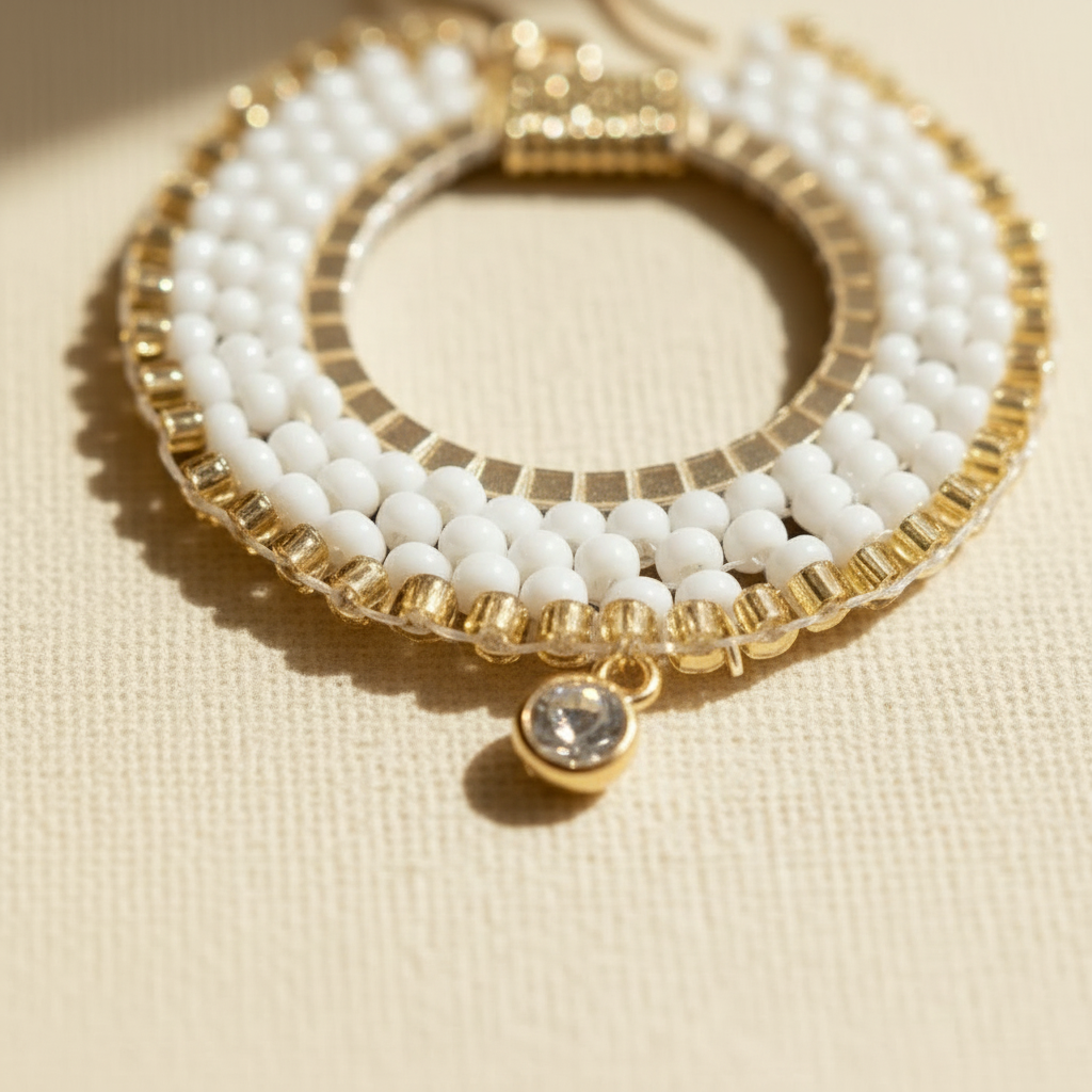 White and gold beaded hoop earrings with delicate clear zircon charms