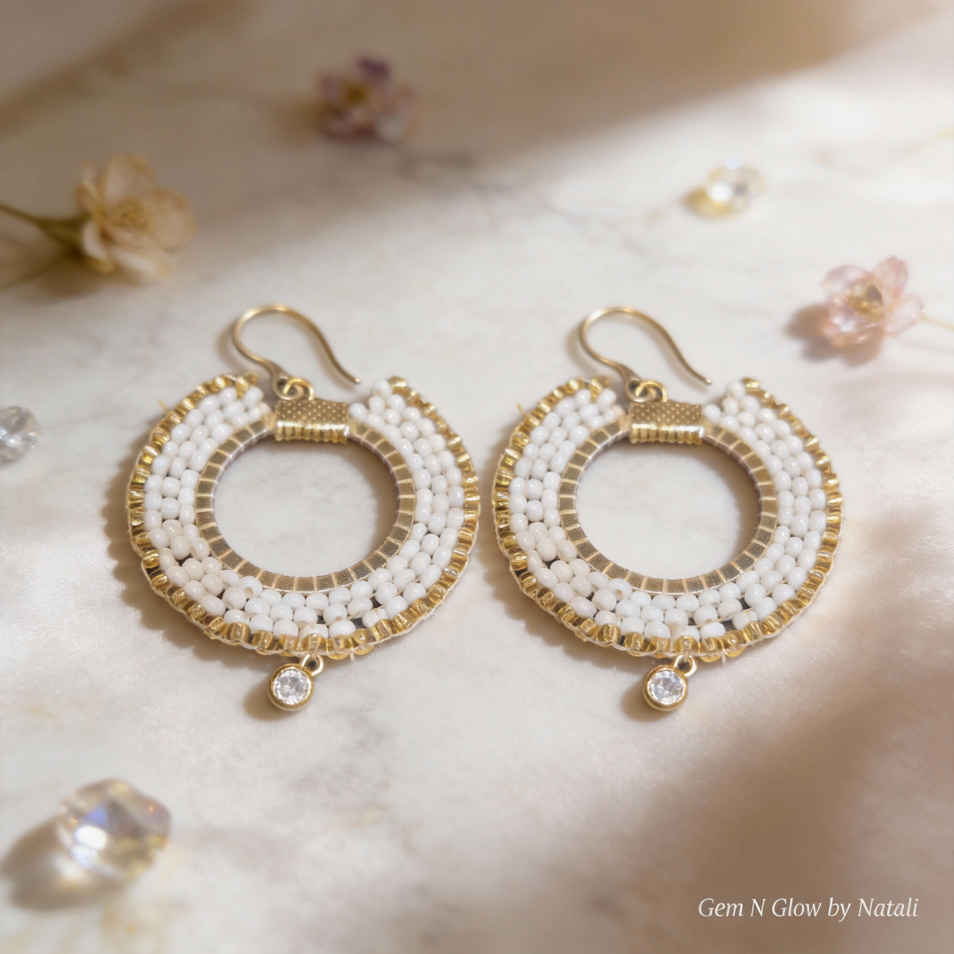 Aurelia Éclat handmade earrings with white Miyuki beads, gold-plated details and clear zircon drops