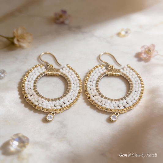 Aurelia Éclat handmade earrings with white Miyuki beads, gold-plated details and clear zircon drops