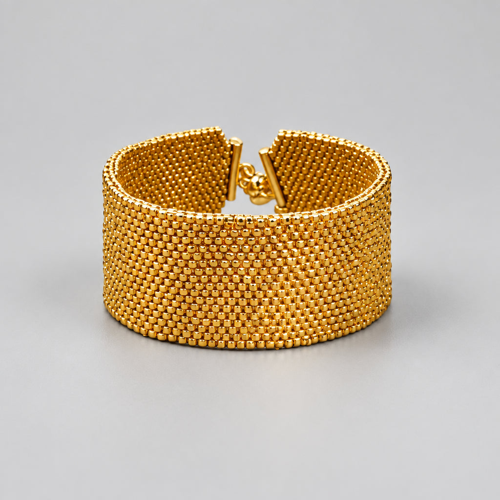 Éclat Doré wide handwoven cuff with 24K gold-plated Miyuki Delica beads