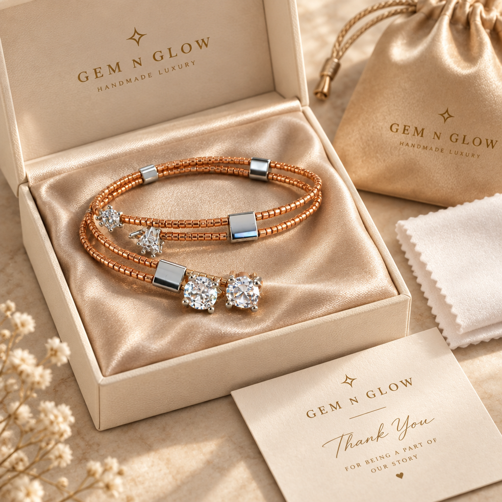Éclat Mirror Duo bracelet displayed in a Gem N Glow gift box beside a matching pouch, polishing cloth and thank-you card.