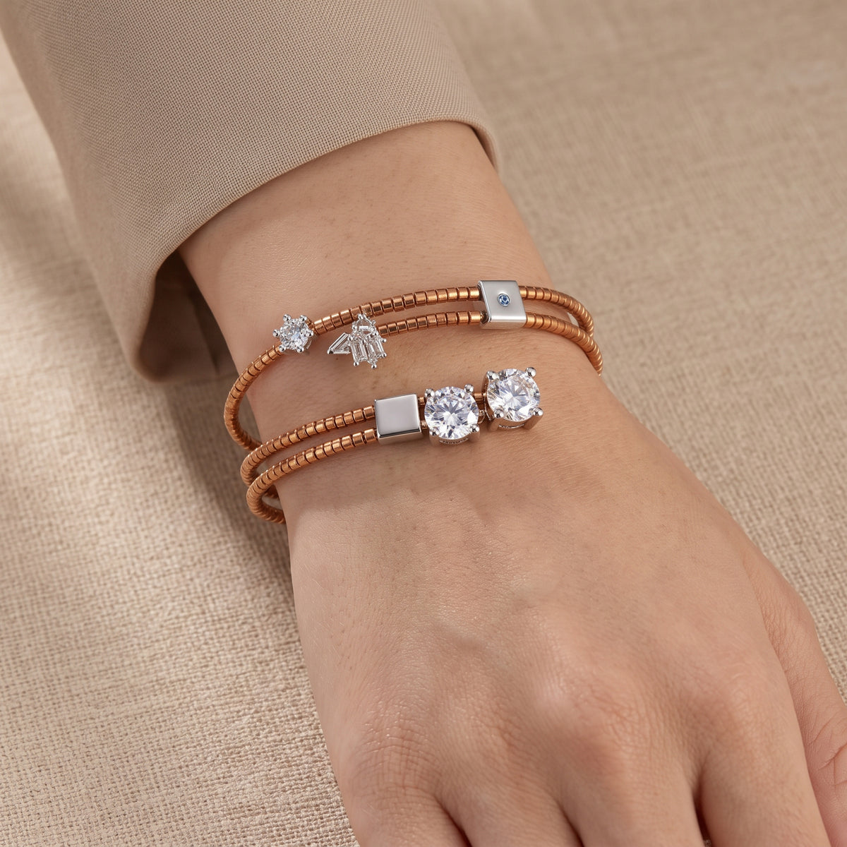 Éclat Mirror Duo rose-gold-tone wrap bracelet worn on the wrist, showing its layered beadwork, silver squares and clear zircon accents.