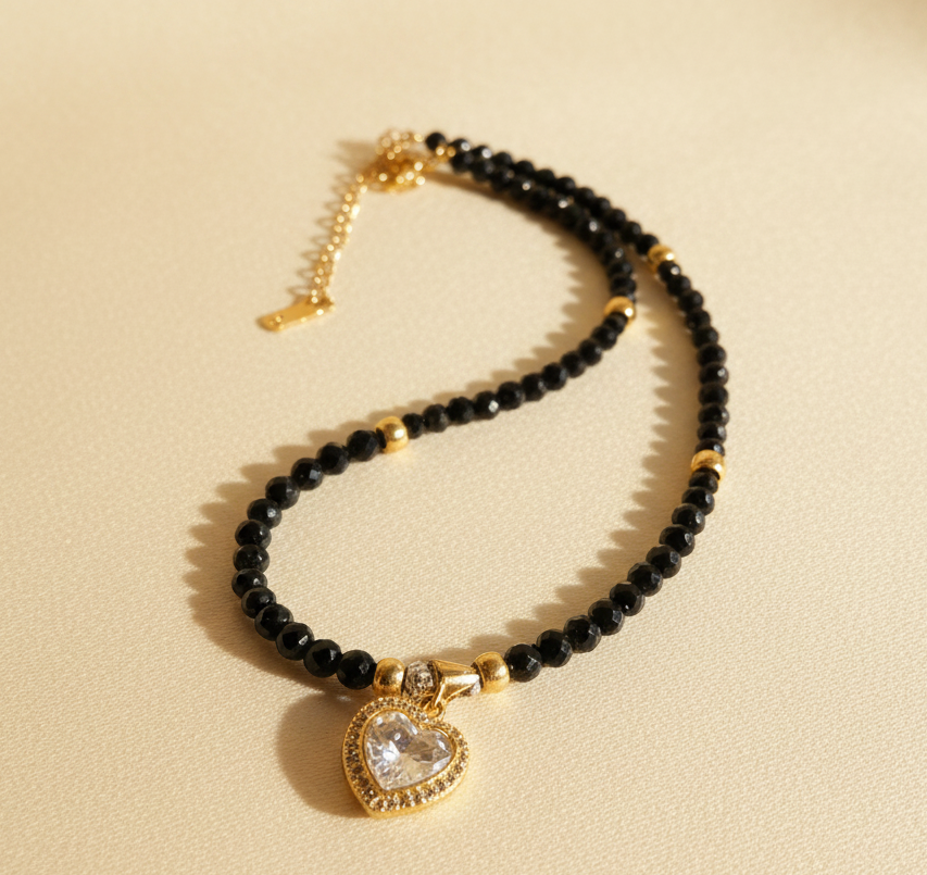 Eclipse Amour handmade black onyx necklace with gold-plated accents and zirconia heart pendant