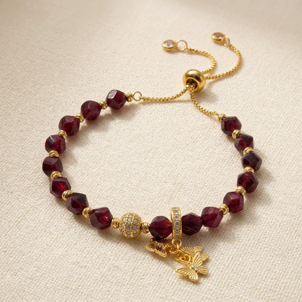 Garnet Flutter handmade garnet bracelet with gold-plated butterfly detail