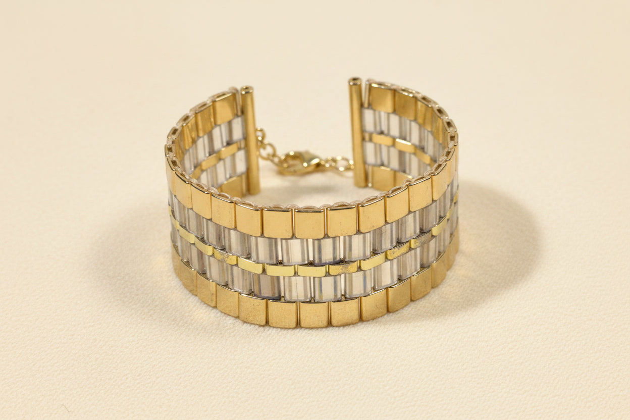 Golden Axis cuff handwoven with gold and smoky-grey Japanese Miyuki Tila beads