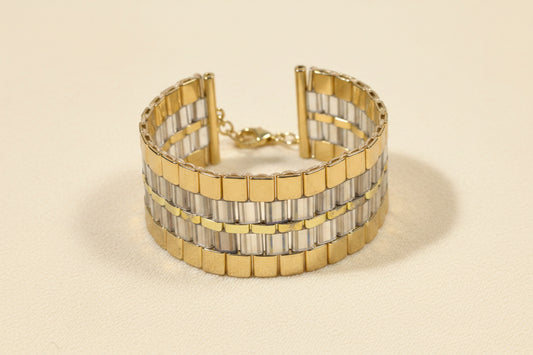 Golden Axis cuff handwoven with gold and smoky-grey Japanese Miyuki Tila beads