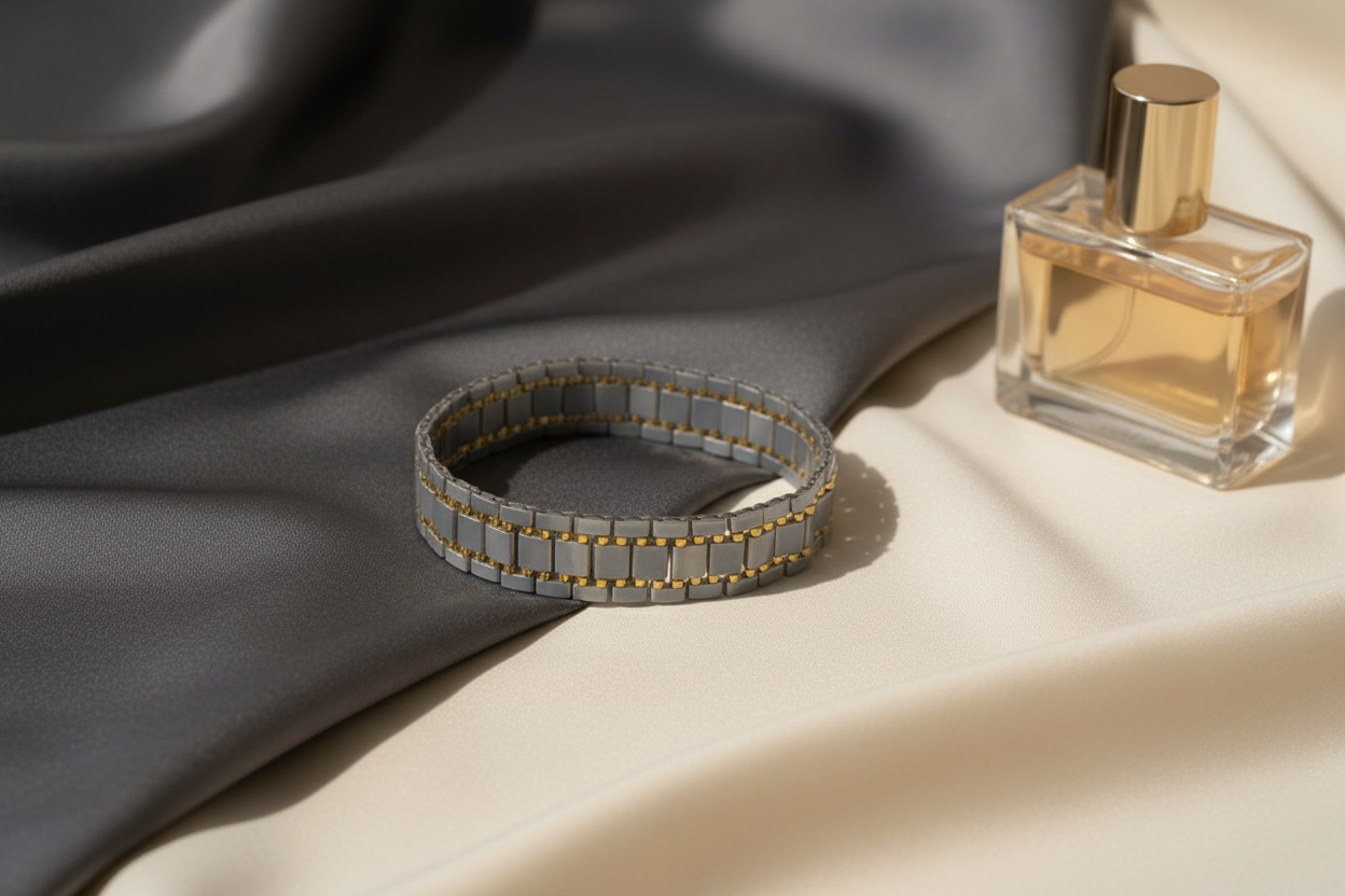 Handmade grey and gold geometric bracelet styled on ivory silk