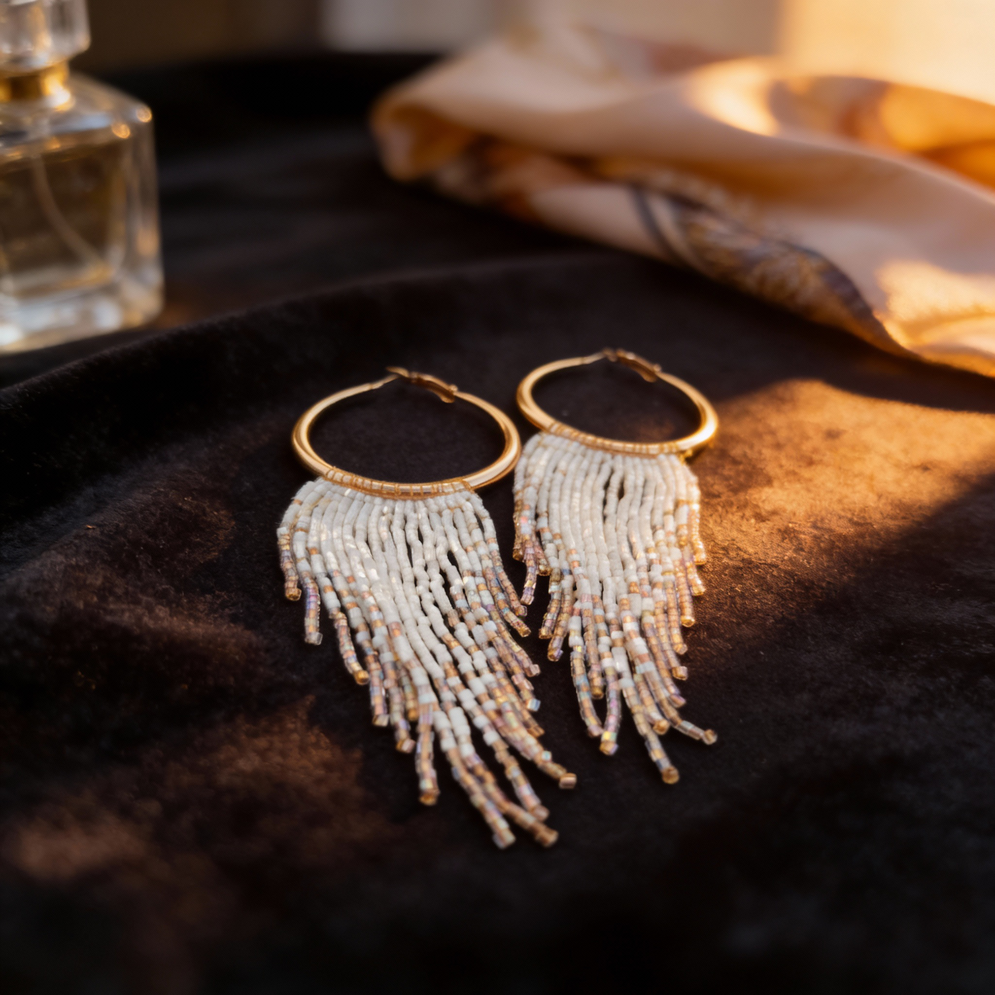 Ivory Cascade beaded fringe earrings styled in a luxury setting