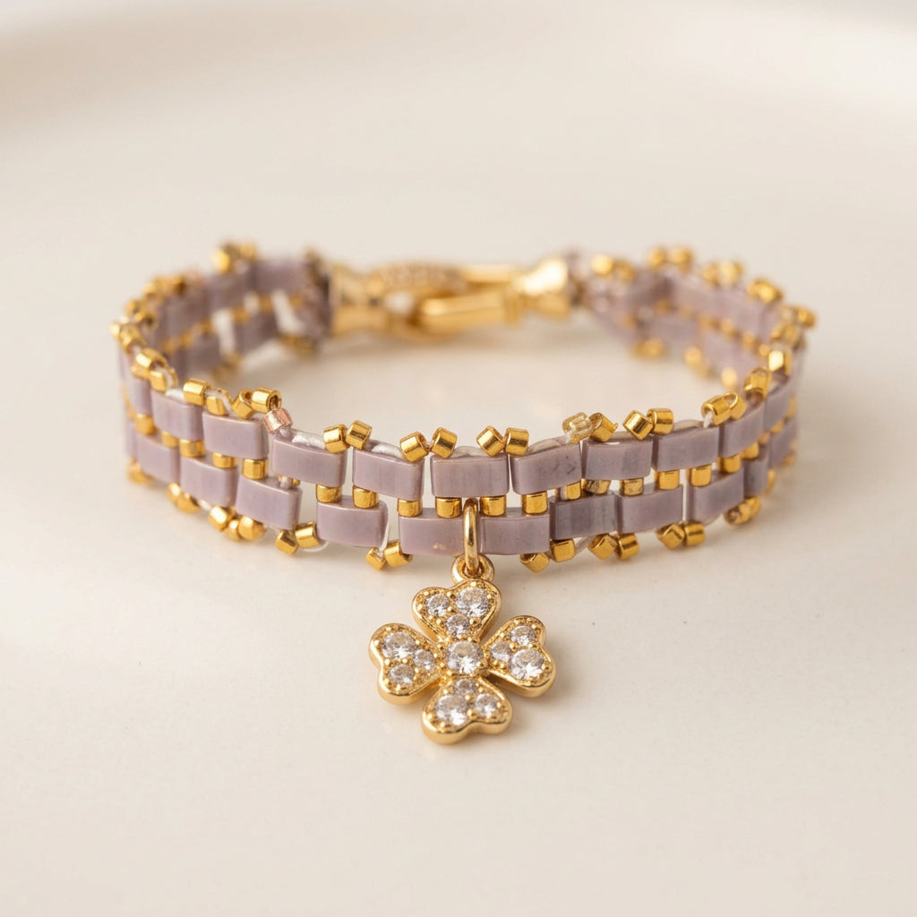 Handmade lilac-grey and gold Miyuki bracelet with clover charm