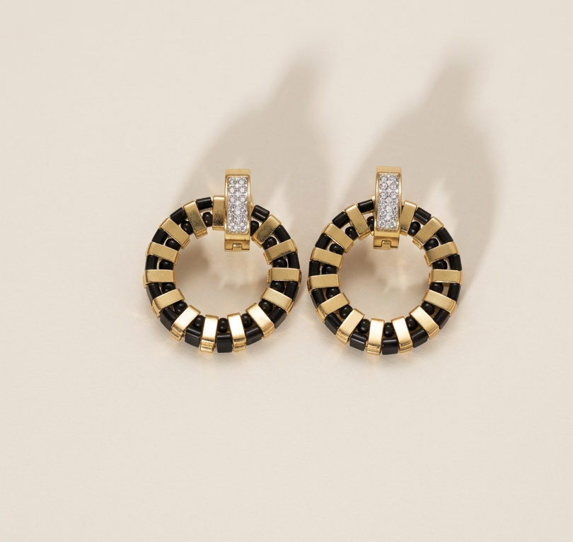Noir Grid circular earrings with black and gold Miyuki Tila beadwork and gold-plated cubic zirconia hoops.