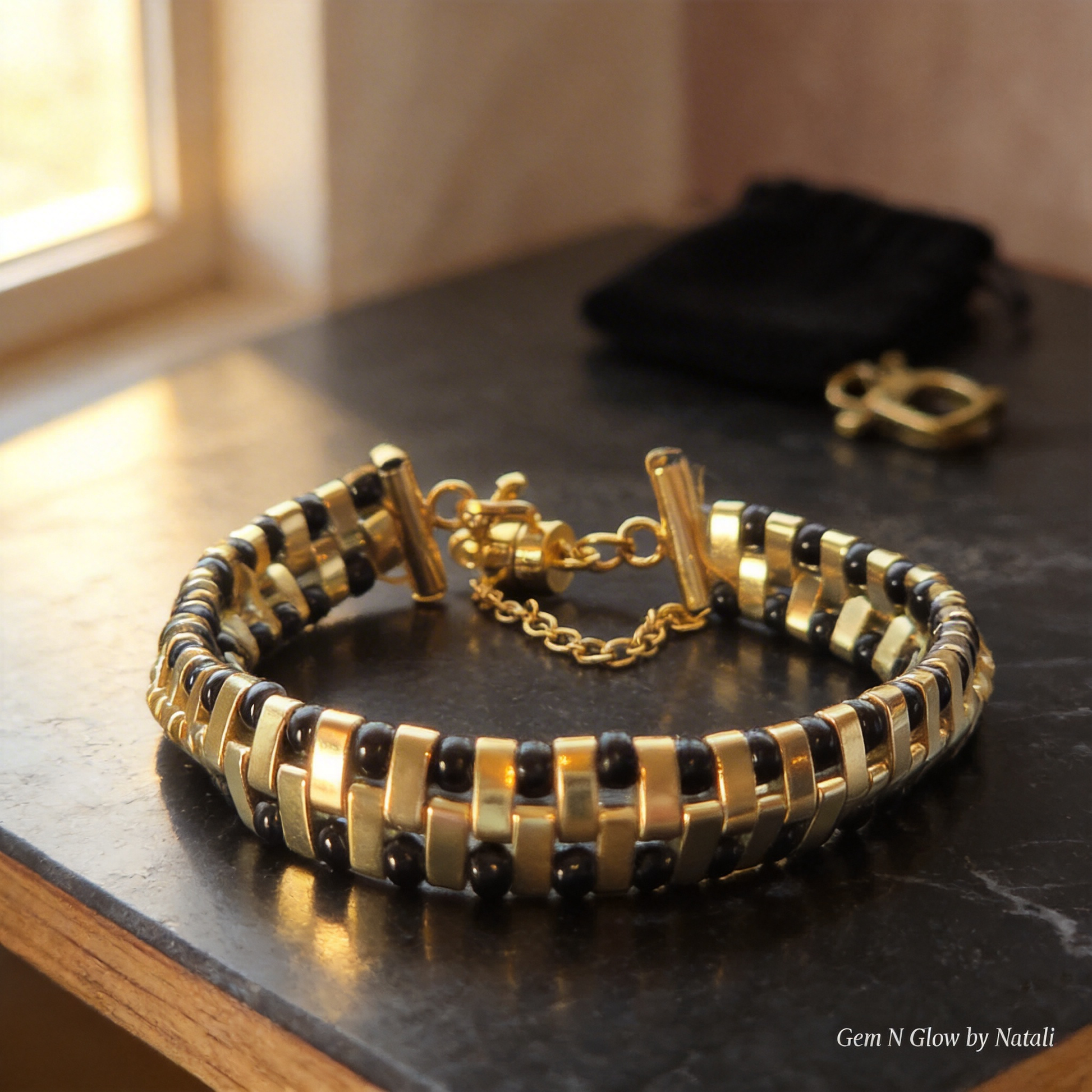 Noir Grid bracelet handwoven with black and metallic gold Japanese Miyuki beads