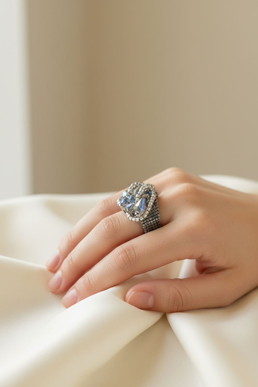 Wide Swarovski crystal statement ring worn on a woman’s hand