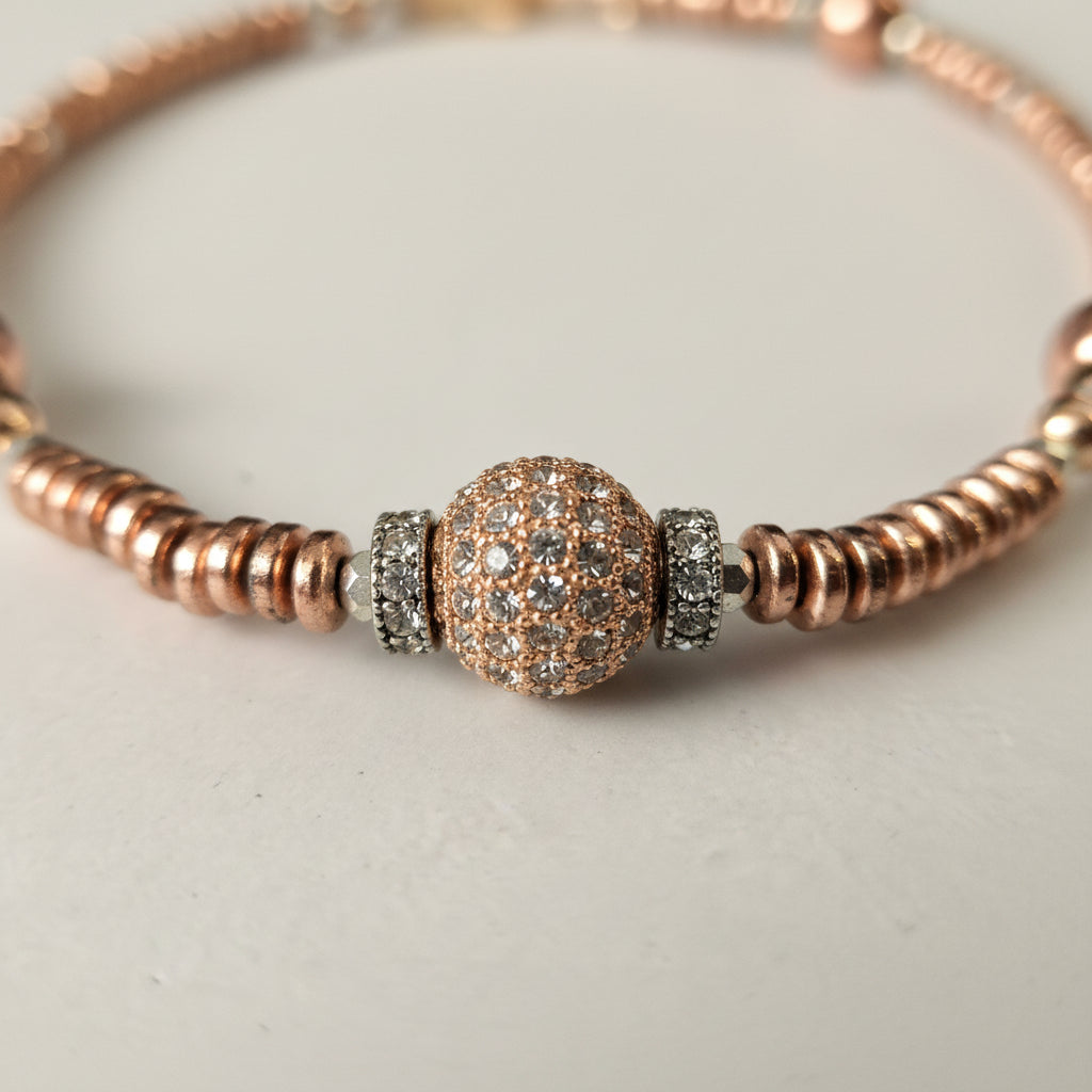 Close-up of sparkling crystal pavé bead and metallic hematite details