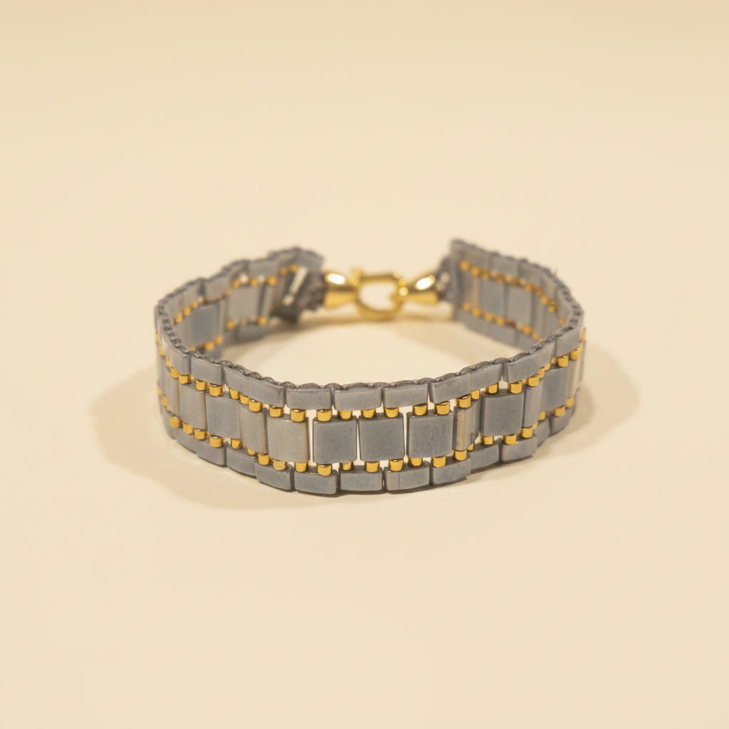 Slate Gold wide bracelet handmade with grey Miyuki Tila beads and golden accents